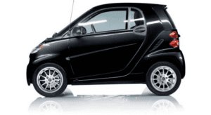 Black compact two-seater smart car on white background.