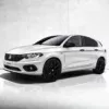 White Fiat Tipo hatchback with black wheels and a sleek design on a neutral background.